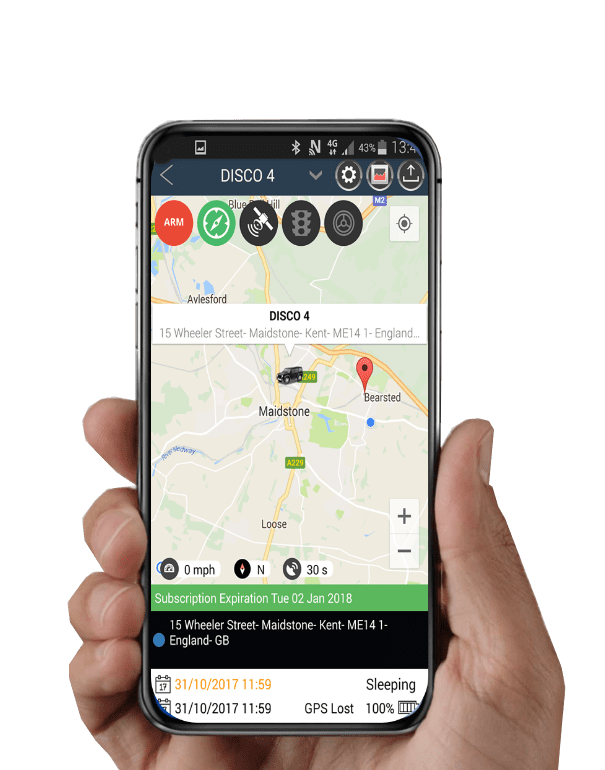 A person holding up a smartphone with a gps app on it.